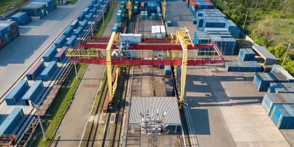 Aerial view of multicolored freight containers at the railway customs