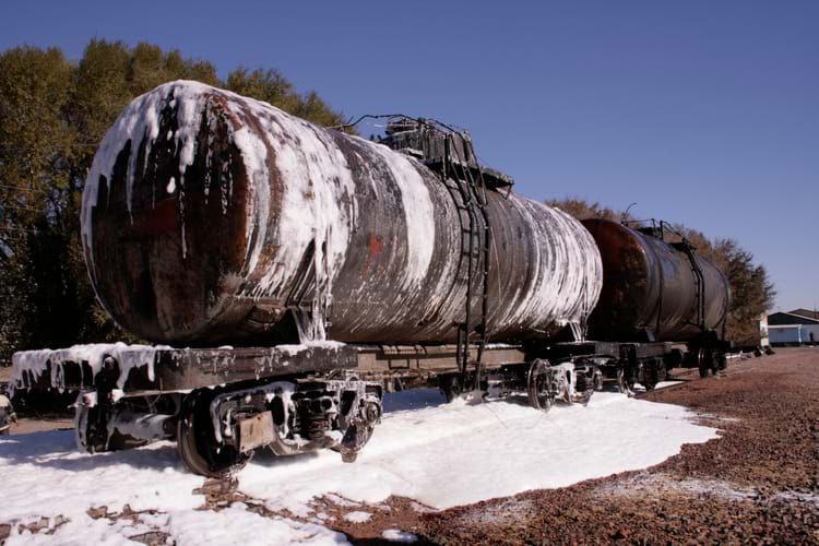 Burning tank cars extinguished by foam spray to stop a railroad disaster