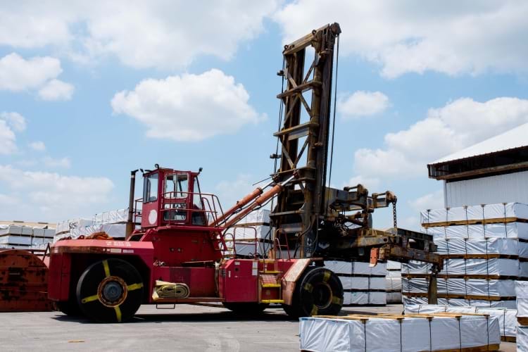 A Taylor toploader loading pallets of packaged goods at a transload facility