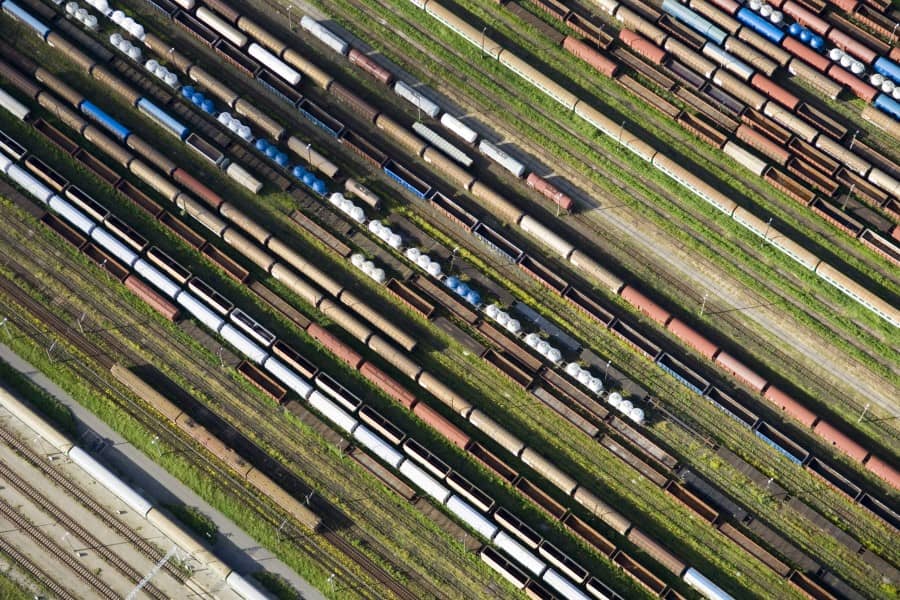 Aerial view of rail cars on the tracks of a rail park