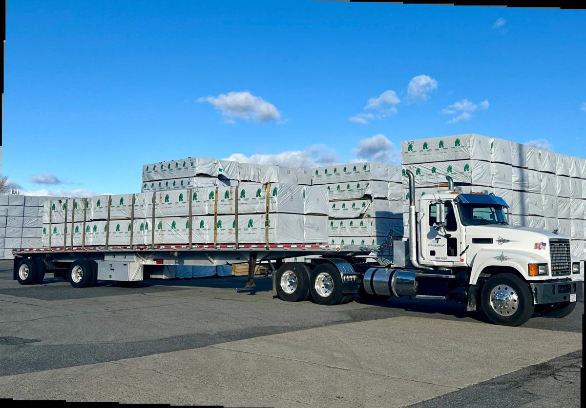 Flatbed truck loaded with packaged building materials at Framingham